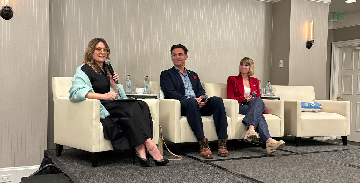 Malin Åkerman shares a heartfelt message during an intimate dinner discussion supporting youth mental health, surrounded by community leaders and advocates.