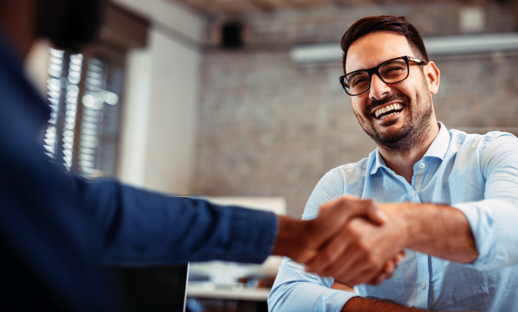 A man shaking hands with another person