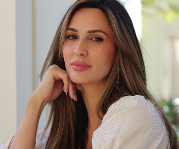 Portrait of Angel Carter featured in Parents Magazine, seated with her hand resting on her chin, highlighting her advocacy for youth mental health and suicide prevention.