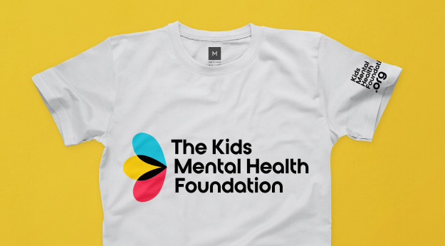 A white "The Kids Mental Health Foundation" short sleeve shirt