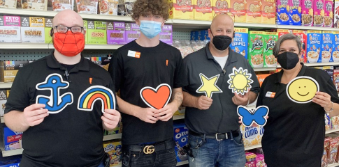 A group of people holding Kids Mental Health Foundation icons